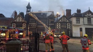 The fire broke out in the roof of the Tudor building and the clock tower is also on fire.