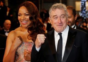 Cast member Robert De Niro and his wife Grace Hightower de Niro pose on the red carpet as they arrive for the screening of the film "Hands of stone" out of competition at the 69th Cannes Film Festival in Cannes, France, May 16, 2016.