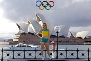 Australian Olympic team member Sally Pearson poses during the official launch of the team uniforms for the 2016 Rio Olympics, in front of the Sydney Harbour Bridge, Australia, April 19, 2016.