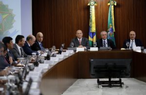 Brazil's Chief of Staff Minister Eliseu Padilha (3rd R), interim President Michel Temer (2nd R), Finance Minister Henrique Meirelles (R) are seen during the first ministerial meeting at the Planalto Palace in Brasilia, Brazil, May 13, 2016.