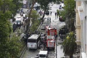 Fire engines stand beside a Turkish oplice bus which awas targeted in a bomb attack in a central Istanbul district, Turkey, June 7, 2016.