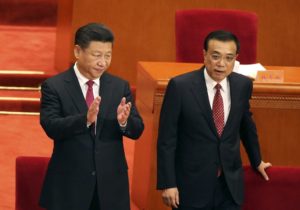 Chinese President Xi Jinping, left, and Premier Li Keqiang attend a ceremony to mark the 95th anniversary of the founding of the Communist Party of China at the Great Hall of the People in Beijing, Friday, July 1, 2016. 