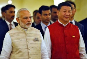 Indian Prime Minister Narendra Modi (L) and Chinese President Xi Jinping arrive for a photo opportunity ahead of BRICS (Brazil, Russia, India, China and South Africa) Summit in Benaulim, in the western state of Goa, India, October 15, 2016.