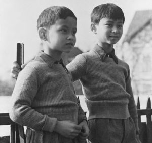  March 7, 1935, file photo, Prince Bhumibol, left, stands with his brother, King Ananda Mahidol of Siam, now known as Thailand, at their school in Lausanne Switzerland. Thailand's Royal Palace said on Thursday, Oct. 13, 2016, that Thailand's King Bhumibol Adulyadej, the world's longest-reigning monarch, has died at age 88.