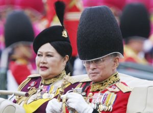 Dec. 2, 2005, file photo,Thailand's King Bhumibol Adulyadej and Queen Sirikit review the honor guard during a ceremony ahead of his 78th birthday in Bangkok. Thailand's Royal Palace said on Thursday, Oct. 13, 2016, that Thailand's King Bhumibol, the world's longest-reigning monarch, has died at age 88.