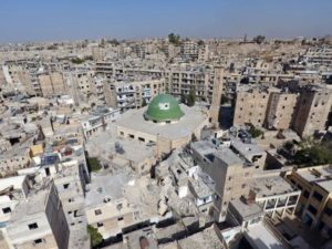A general view taken with a drone shows damaged buildings and a mosque in the old city of Aleppo, Syria. 