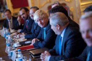 British Foreign Secretary Boris Johnson (C) takes part in a meeting on the situation in Syria at Lancaster House in London October 16, 2016. 