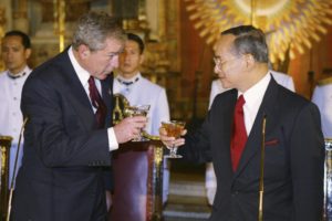Oct. 19, 2003, file photo, Thailand's King Bhumibol Adulyadej, right, toasts U.S. President George W. Bush, left, at the State Dinner at the Grand Palace in Bangkok. Thailand's Royal Palace said on Thursday, Oct. 13, 2016, that King Bhumibol, the world's longest-reigning monarch, has died at age 88.