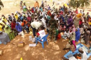 File-People who were rescued after being held captive by Boko Haram, sit as they wait for medical treatment at a camp near Mubi, northeast Nigeria October 29, 2015