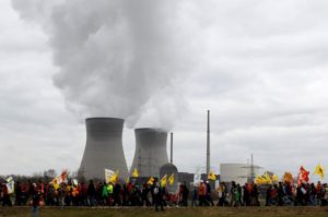 Protesters walk during an anti-nuclear rally in front of the nuclear power plant Gundremmingen March 11, 2012, to mark the first anniversary of Japan's earthquake and tsunami that killed thousands and set off a nuclear crisis. 