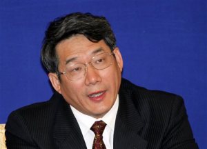  In this April 29, 2009 file photo, Liu Tienan, then the vice chairman of the National Development and Reform Commission, speaks during a press conference in Shanghai, China. The former deputy chief of the agency in charge of steering the world's second-largest economy went on trial Wednesday, Sept. 24, 2014, accused of taking bribes, China's official news agency said. (AP Photo/Eugene Hoshiko, File)