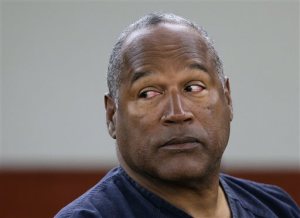 FILE - In this May 13, 2013, file photo,  O.J. Simpson appears during an evidentiary hearing in Clark County District Court, in Las Vegas. Prosecutors in Las Vegas say Simpson got a fair trial in a hotel room confrontation over sports memorabilia, and the evidence supporting his 2008 conviction and imprisonment on kidnapping and armed robbery charges is overwhelming. He has served more than six years of a 9-to-33 year Nevada prison sentence, and isn't eligible for parole until 2017. Simpson lawyers didn't immediately respond Tuesday, Sept. 30, 2014 to messages. Simpson is now 67. (AP Photo/Julie Jacobson, Pool, File)