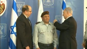Prime Minister Benjamin Netanyahu , right, and Defense Minister Moshe Ya'alon, left, seen with incoming IDF chief of staff Gadi Eizenkot at a ceremony in Jerusalem, on February 16, 2015 Read more: Nodding to 'challenges,' Eisenkot takes over as IDF head