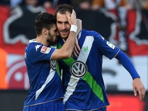 Wolfsburg's midfielder Daniel Caligiuri (L) and Wolfsburg's Dutch striker Bas Dost celebrate