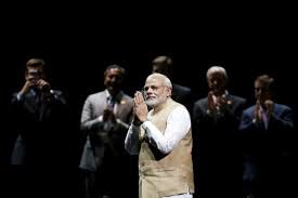 Indian Prime Minister Narendra Modi gestures on stage during a community reception at SAP Center in San Jose, California September 27, 2015.