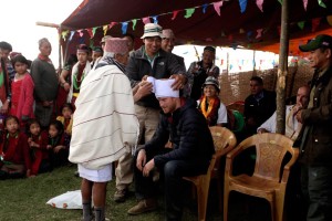 A turban is being tied on Britain’s Prince Harry’s head during his visit in Lamjung, Nepal, Monday, March 21, 2016. 