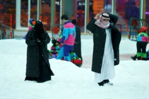 A Saudi couple walks in the new Snow City at Al Othaim Mall in Riyadh, Saudi Arabia July 26, 2016. Picture taken July 26, 2016. 