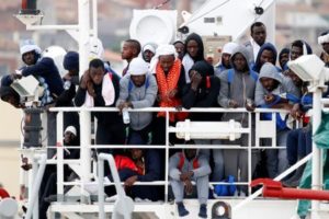 Migrants wait to disembark from a MSF (Medecins Sans Frontieres) vessel in the Sicilian harbour of Catania, Italy, November 6, 2016.