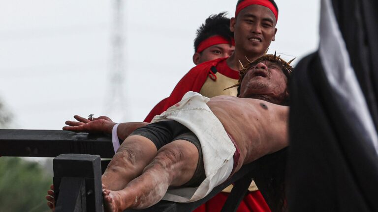 A Filipino villager is nailed to a cross for the 35th time on Good Friday to pray for world peace